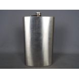 An extremely large novelty hip flask,