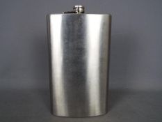 An extremely large novelty hip flask,