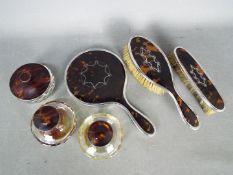 A George V hallmarked silver mounted and faux tortoiseshell,