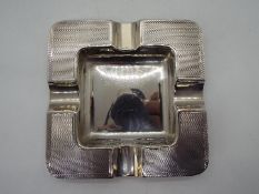 A square silver ashtray, Birmingham hallmark 1935,