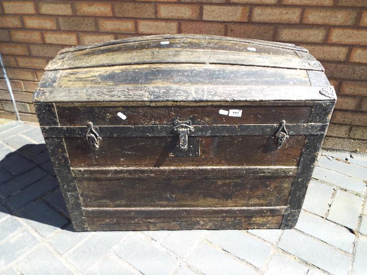 A metal bound dome top trunk, approximately 64 cm x 81 cm x 49 cm. - Image 3 of 3