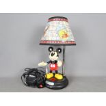 A Disney, Mickey Mouse 'Through The Ages' table lamp, approximately 47 cm (h).