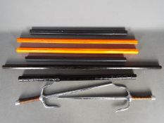 Six martial arts training sticks for use in various forms of martial art and two steel sai