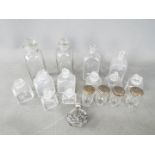 A collection of vintage glass bottles and stoppers,