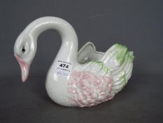 An Italian, ceramic centrepiece in the form of a swan, approximately 17.