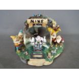 A Disney musical snow globe featuring the Seven Dwarfs from the film 'Snow White And The Seven