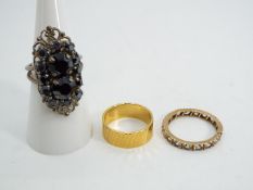A yellow metal stone set eternity ring (unmarked) presumed 9ct gold, size N, approx weight 1.