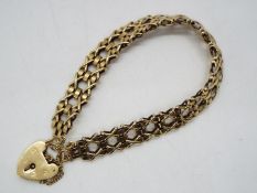 A gate link bracelet with padlock clasp stamped 375 and safety chain, 17 cm (l), approximately 12.