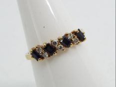 9ct gold - a 9 ct gold diamond and sapphire ring, stamped 375 (rest of hallmark unclear), size N,