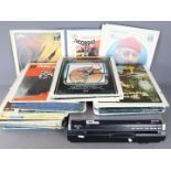 An Hitachi Video Disc Player and a collection of video discs to include Escape From New York,