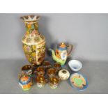 A collection of Oriental ceramics to include a 'Genuine Samurai China' hand painted tea set,