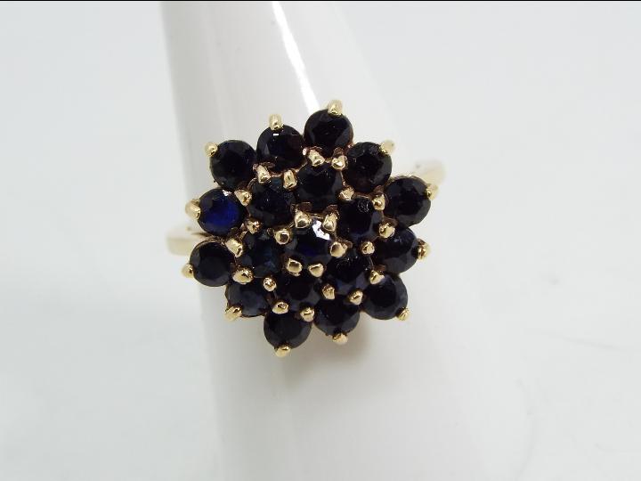 9ct gold - a 9 ct gold sapphire cluster ring, cluster measures 2 cm (d), size O½, approx weight 4.