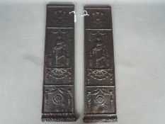 A pair of Victorian cast iron plaques or fireplace inserts by Carron Company,