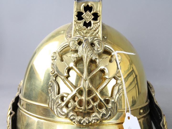 A fireman's brass helmet (reproduction). - Image 10 of 10