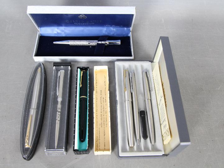 A collection of pens and pencil comprising a Parker ballpoint, Parker propelling pencil,