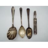 A small collection of hallmarked silver items to include spoons and a George VI everlasting match