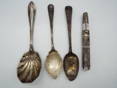 A small collection of hallmarked silver items to include spoons and a George VI everlasting match