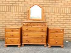A pine vanity chest of drawers 132 cm x 76 cm x 46 cm and two bedside chests 57 cm x 45 cm x 46 cm.