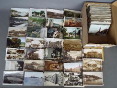 In excess of 500 mainly early period UK topographical postcards to include street scenes and a few