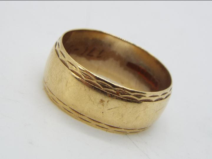 A 9ct gold wedding band, size T, approximately 5.5 grams all in.