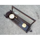 A good quality contemporary dark wood cased wall timepiece,