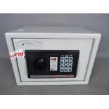 A Home Protector digital electronic safe, approximately 25 cm x 35 cm x 26 cm,