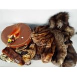 A collection of furs to include a coat, stoles and similar and a Decovulcan hat box.