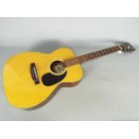 A Lorenzo Model M 19/G, six string acoustic guitar.