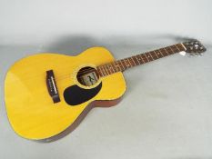 A Lorenzo Model M 19/G, six string acoustic guitar.