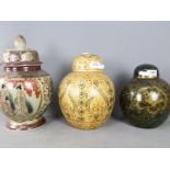 Three Oriental ginger jars and covers, largest approximately 31 cm (h).