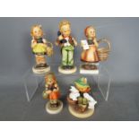 Hummel - Five Hummel figurines comprising a boy with a telephone, girls with baskets and similar,