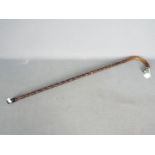 A good quality walking stick with silver