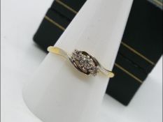 An 18ct gold and platinum crossover ring