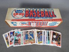 Baseball Cards. A complete boxed set of Fleer 1990 Baseball stickers and trading cards.