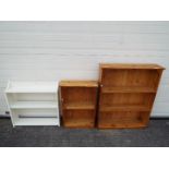 Three freestanding bookcases, largest approximately 97 cm x 80 cm x 22 cm.