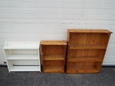 Three freestanding bookcases, largest approximately 97 cm x 80 cm x 22 cm.