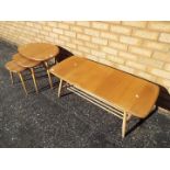 An Ercol coffee table with spindle under tier,