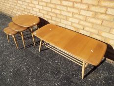 An Ercol coffee table with spindle under tier,