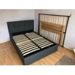A faux leather double bed with storage drawer to one side, dismantled for transportation.