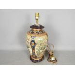 An Oriental vase converted to a table lamp,