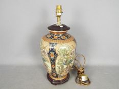 An Oriental vase converted to a table lamp,