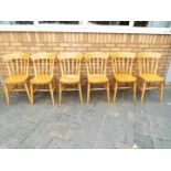 Six kitchen or dining chairs.