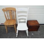 A white painted rocking chair, a further chair and a Yates Bros & Co shipping box.