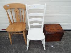 A white painted rocking chair, a further chair and a Yates Bros & Co shipping box.