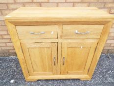 A light oak sideboard measuring approximately 89 cm x 90 cm x 40 cm.