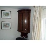 A wall mountable corner unit with inlaid decoration,