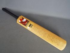 A Morrant cricket bat bearing signatures of Yorkshire and Lancashire including Geoffrey Boycott,