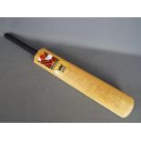 A Morrant cricket bat bearing signatures of Yorkshire and Lancashire including Geoffrey Boycott,