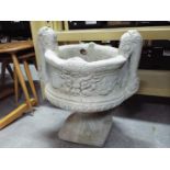 Garden Stoneware - a reconstituted stoneware twin-handled planter on pedestal base,