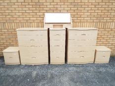 A suite of chests of drawers, largest approximately 111 cm x 86 cm x 49 cm and a matching mirror.